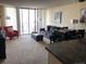 Spacious living room with comfortable seating, dining area, and city views at 1020 15Th St # 26I, Denver, CO 80202