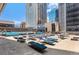 Relaxing pool area with lounge chairs at 1020 15Th St # 26I, Denver, CO 80202