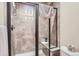 Bathroom with shower, toilet, and built-in seat at 7818 Vallagio Ln, Englewood, CO 80112