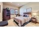 Bedroom with a queen-size bed and a TV stand at 7818 Vallagio Ln, Englewood, CO 80112