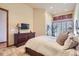 Relaxing bedroom with a dresser and neutral tones at 7818 Vallagio Ln, Englewood, CO 80112
