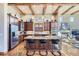 Spacious kitchen features granite counters, stainless steel appliances, and island at 7818 Vallagio Ln, Englewood, CO 80112