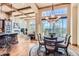 Open kitchen with granite countertops, wood cabinets, and an island with seating at 7818 Vallagio Ln, Englewood, CO 80112