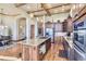 Open kitchen boasts granite countertops and stainless steel appliances at 7818 Vallagio Ln, Englewood, CO 80112