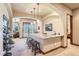 Basement wet bar with granite countertop and seating at 7818 Vallagio Ln, Englewood, CO 80112