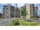 Front view of the building with parking and landscaping at 13901 E Marina Dr # 105, Aurora, CO 80014