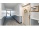 Apartment hallway with light-colored walls and carpet at 13901 E Marina Dr # 105, Aurora, CO 80014