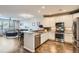 Open concept kitchen with granite countertops and island at 1781 S Buchanan Cir, Aurora, CO 80018