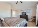 Main bedroom with king-size bed, dresser, and window views at 1781 S Buchanan Cir, Aurora, CO 80018