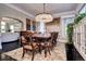 Formal dining room with large table, chandelier, and hardwood floors at 4101 E 17Th Avenue Pkwy, Denver, CO 80220