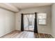 Spacious bedroom with sliding glass door to patio at 5800 Tower Rd # 503, Denver, CO 80249