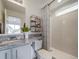 Modern bathroom with granite vanity and walk-in shower at 12986 E 103Rd Ave, Commerce City, CO 80022