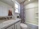 Clean bathroom with granite countertop and bathtub at 12986 E 103Rd Ave, Commerce City, CO 80022