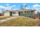 Charming green ranch home with a newly remodeled front entrance at 6926 E Dickenson Pl, Denver, CO 80224