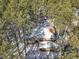 Aerial view of house in snowy woods at 720 Arapahoe Dr, Monument, CO 80132