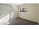 Bright bedroom with double door closet and carpet flooring at 720 Arapahoe Dr, Monument, CO 80132