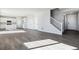 Open living area with gray vinyl flooring and kitchen island at 5768 Ranch St, Mead, CO 80504