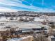Aerial view of property featuring a large metal building and surrounding landscape at 567 Lake Gulch Rd, Castle Rock, CO 80104
