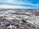 Aerial view of property with snow-covered landscape and distant mountains at 567 Lake Gulch Rd, Castle Rock, CO 80104