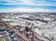 Aerial view showing property location near a road and snowy landscape at 567 Lake Gulch Rd, Castle Rock, CO 80104