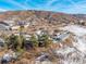 Aerial view of property with residential buildings and a large workshop at 567 Lake Gulch Rd, Castle Rock, CO 80104