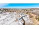 Aerial view of property near stream and mountains at 567 Lake Gulch Rd, Castle Rock, CO 80104