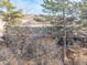 Ranch home nestled in trees with a large deck at 567 Lake Gulch Rd, Castle Rock, CO 80104