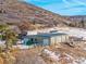 Several outbuildings on a property with a truck and dumpster at 567 Lake Gulch Rd, Castle Rock, CO 80104