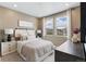 Comfortable bedroom with large windows and neutral color palette at 4194 Ridgewalk Pt, Castle Rock, CO 80108