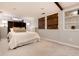 Finished basement bedroom with plush carpet and built-in shelving at 2301 E Yale Ave, Denver, CO 80210