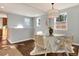 Dining room with glass-top table and white chairs at 2301 E Yale Ave, Denver, CO 80210