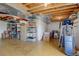 Unfinished basement area with shelving and storage at 3211 Westbrook Ln, Highlands Ranch, CO 80129