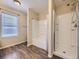 Bathroom with bathtub, shower, and wood-look floors at 2508 Coach House Loop, Castle Rock, CO 80109