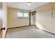 Bedroom with carpeted floors, a window, and a closet at 102 Douglas Fir Ave, Castle Rock, CO 80104