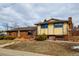 Front exterior of a two-story home with brick and siding, walkway, and landscaping at 102 Douglas Fir Ave, Castle Rock, CO 80104