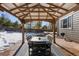 Covered patio with table and chairs, perfect for outdoor dining at 1078 Eaglestone Dr, Castle Rock, CO 80104