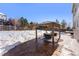 Spacious backyard patio with snow covered ground at 1078 Eaglestone Dr, Castle Rock, CO 80104