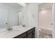 Bathroom with double vanity, light countertops, and a shower/tub combo at 5535 Tamarack Ave, Firestone, CO 80504