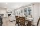 Bright dining room with a table and chairs, adjacent to the living area at 21382 E 60Th Ave, Aurora, CO 80019