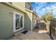 Small back patio with sliding glass door access at 11207 Holly St, Thornton, CO 80233