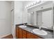 Bathroom with double vanity and large mirror at 7440 S Blackhawk St # 10-203, Englewood, CO 80112