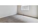 Empty carpeted bedroom with neutral walls and window at 25025 E 41St Ave, Aurora, CO 80019