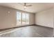 Spacious bedroom with large windows and wood floors at 12983 W Ida Ave # 111, Littleton, CO 80127
