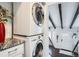 Stackable washer and dryer in a convenient laundry room with wood beam accents at 997 S Miller Way, Lakewood, CO 80226