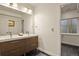 Basement bathroom with double vanity and modern finishes at 385 N Flat Rock St, Aurora, CO 80018