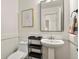 Small bathroom with pedestal sink, toilet and simple decor at 385 N Flat Rock St, Aurora, CO 80018