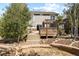 Two-story house with a deck and landscaped backyard at 385 N Flat Rock St, Aurora, CO 80018