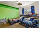 bedroom with bunk beds, green walls, and ample toy storage at 385 N Flat Rock St, Aurora, CO 80018