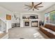 Living room features a fireplace and built-in shelving at 385 N Flat Rock St, Aurora, CO 80018