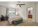 Main bedroom with private bathroom access and ceiling fan at 385 N Flat Rock St, Aurora, CO 80018